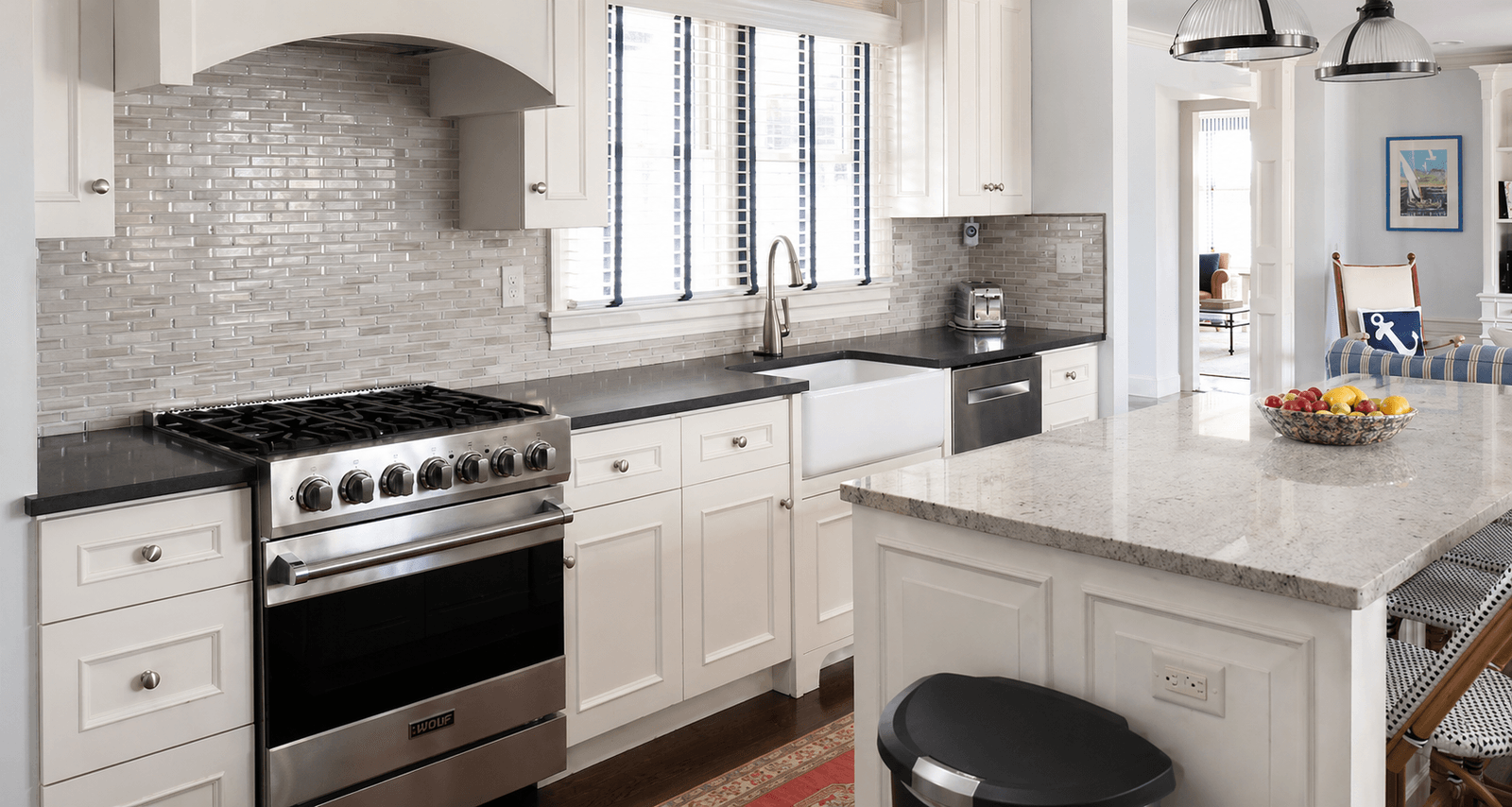 White painted kitchen cabinets with dark counters