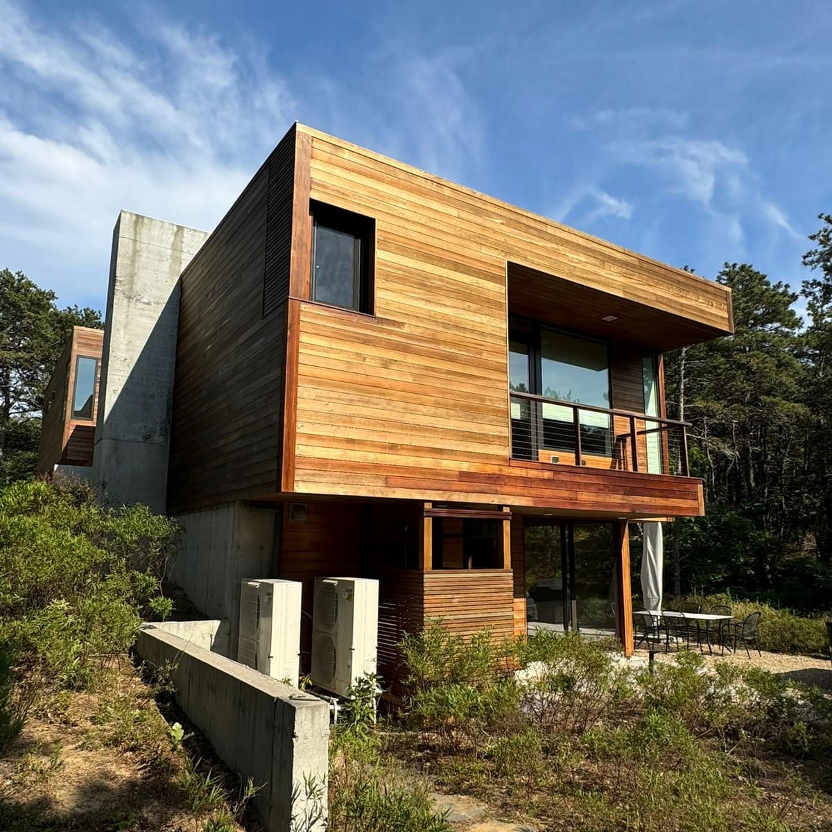 Modern cedar exterior with clean trim and glass railings