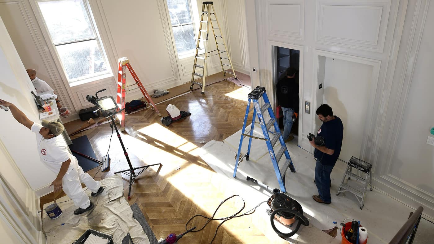 Elite Painting Services crew preparing an exterior painting project