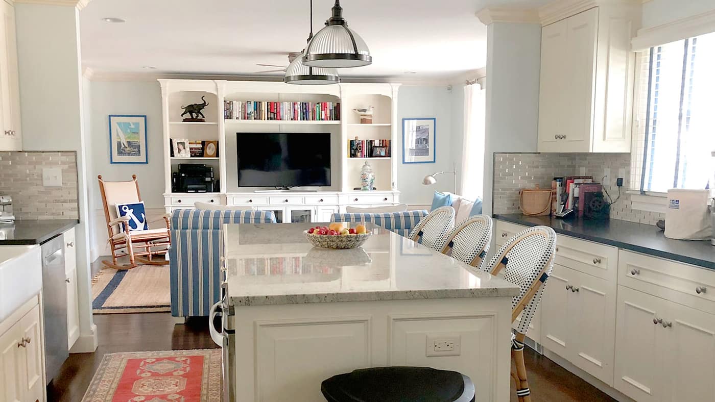 Bright Cape Cod coastal living room with painted trim and built-ins
